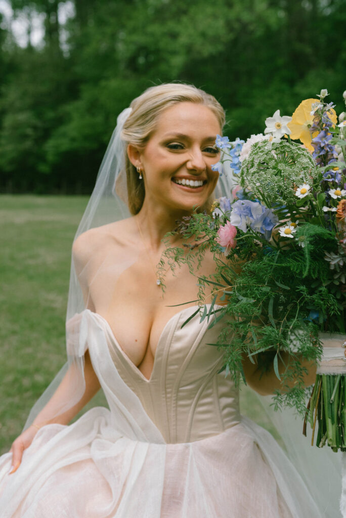 Bride in custom pink carol hannah gown 