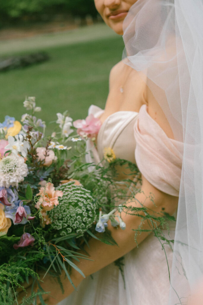 Bride in custom pink Carol Hannah gown 