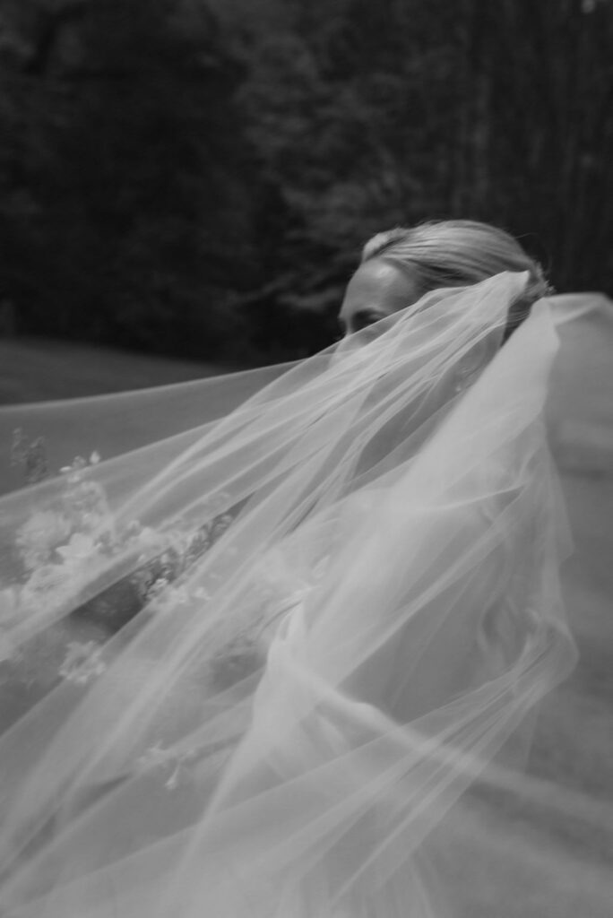 Bride in black and white with veil 