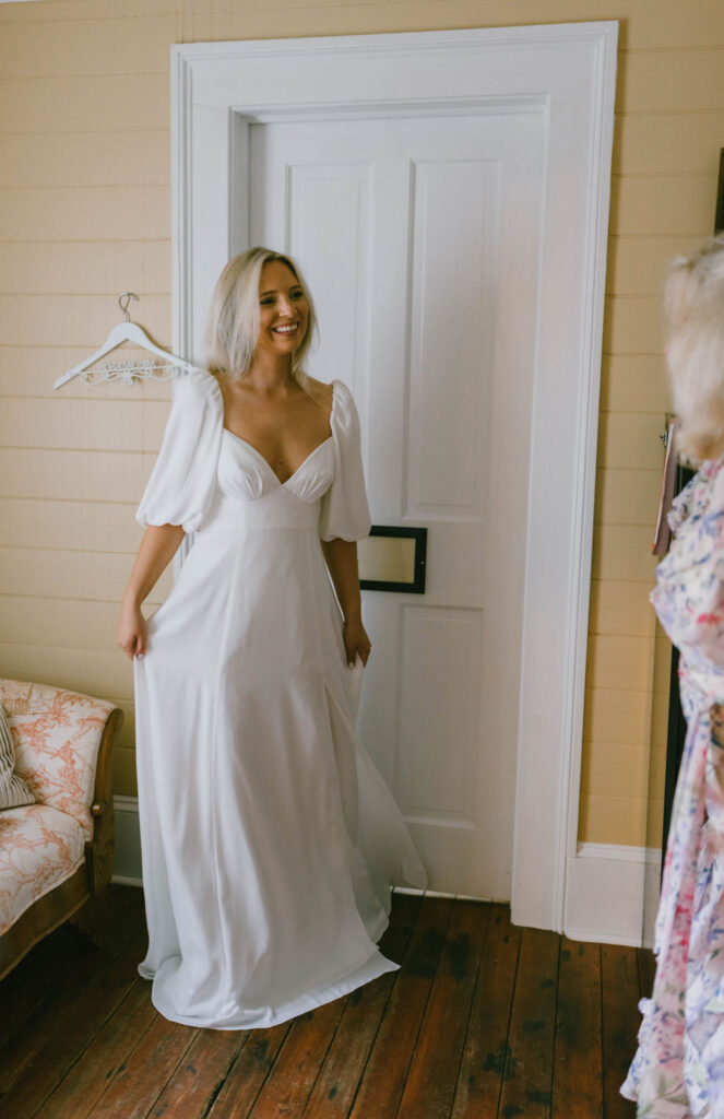 Bride showing off her wedding dress