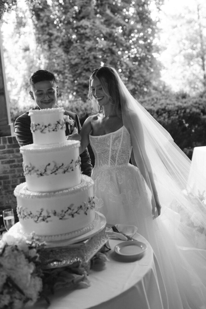 Bride and groom cutting their wedding cake