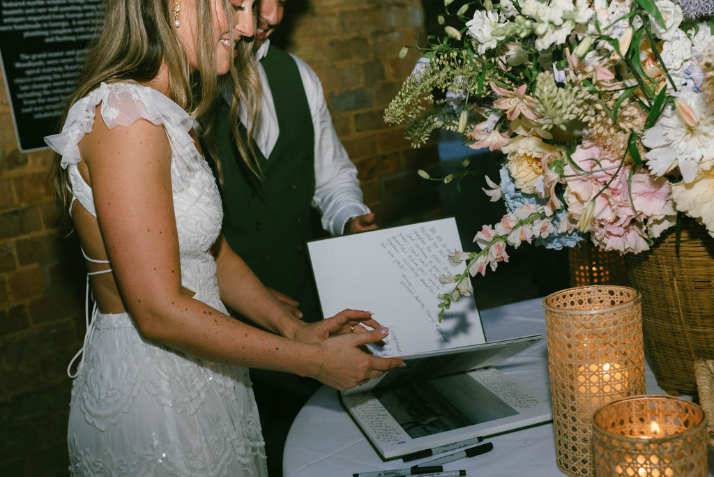 Bride and groom reading their guest book