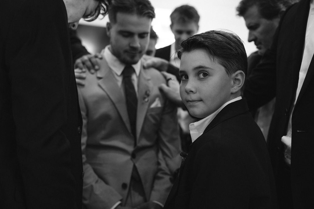 groom getting ready at jane austen inspired intimate backyard wedding