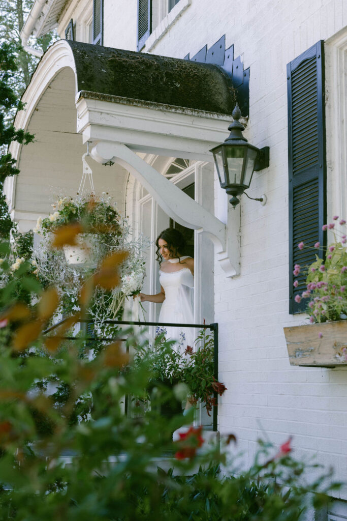 bride walking out of house to jane austen inspired intimate backyard wedding