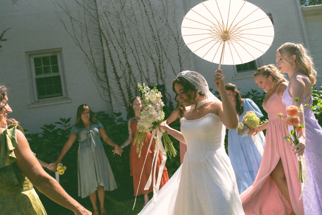 bride & bridesmaids getting ready at jane austen inspired intimate backyard wedding