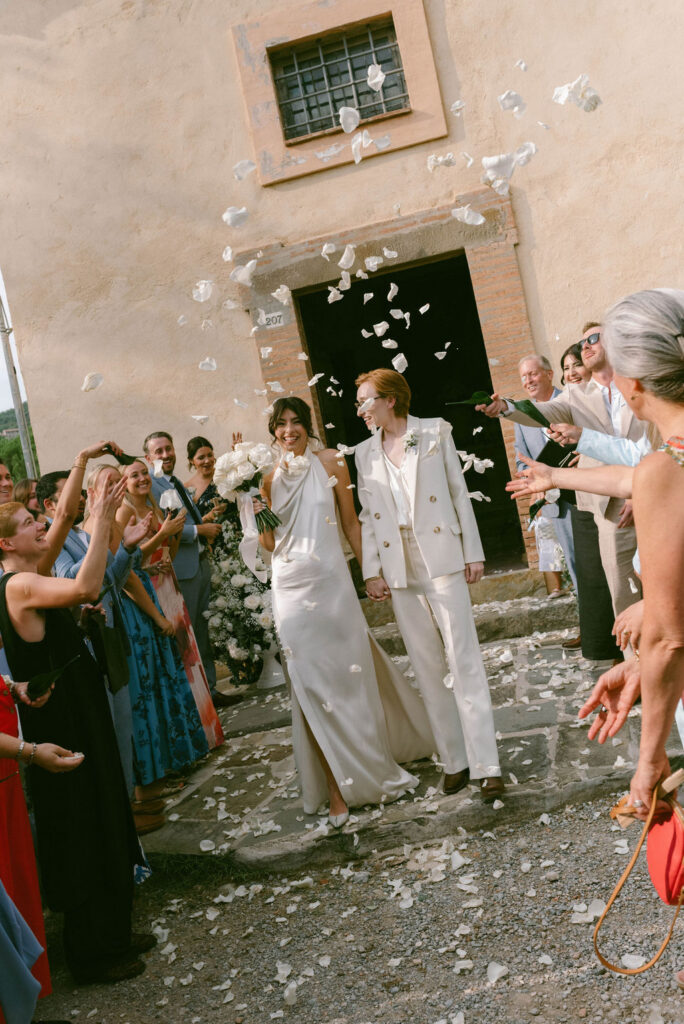 an intimate Italian escape wedding lgbtq wedding ceremony exit flower confetti 