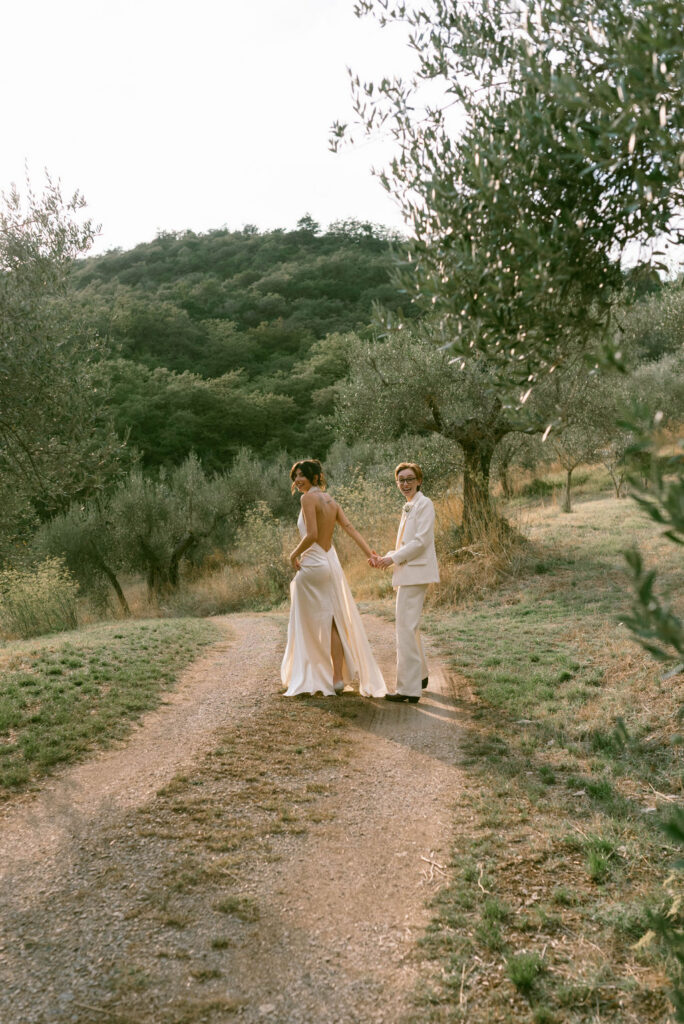 an intimate Italian escape wedding lgbtq wedding reception in an olive tree grove