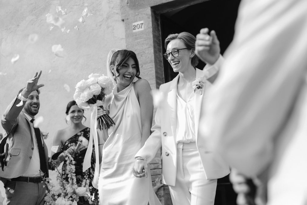 an intimate Italian escape wedding lgbtq wedding ceremony exit flower confetti 