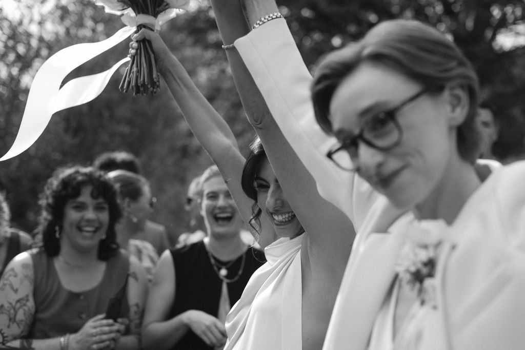 an intimate Italian escape wedding lgbtq wedding ceremony exit flower confetti 