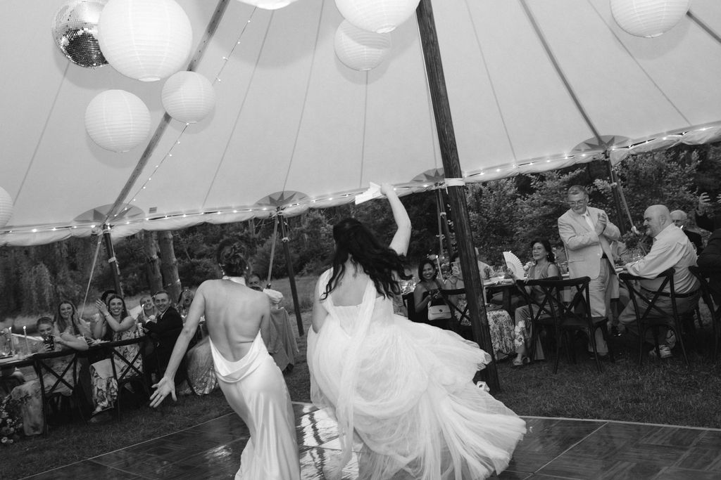 An Upstate New York Wedding at Woodhouse Lodge LGBTQ wedding cake cutting