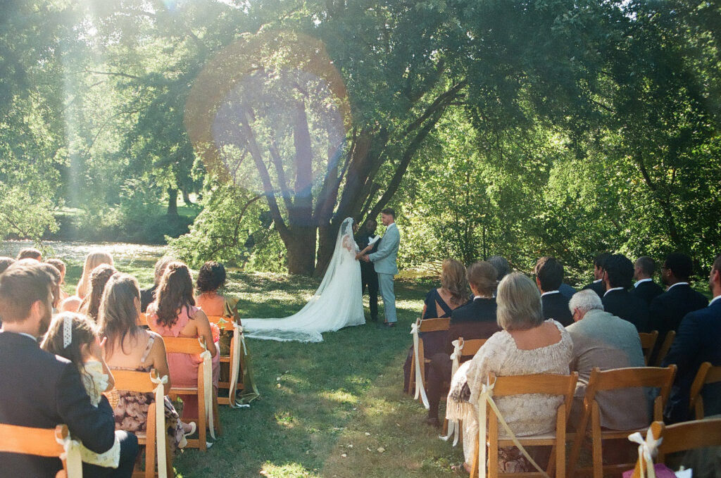 bride & groom ceremony at a jane austen inspired intimate backyard wedding