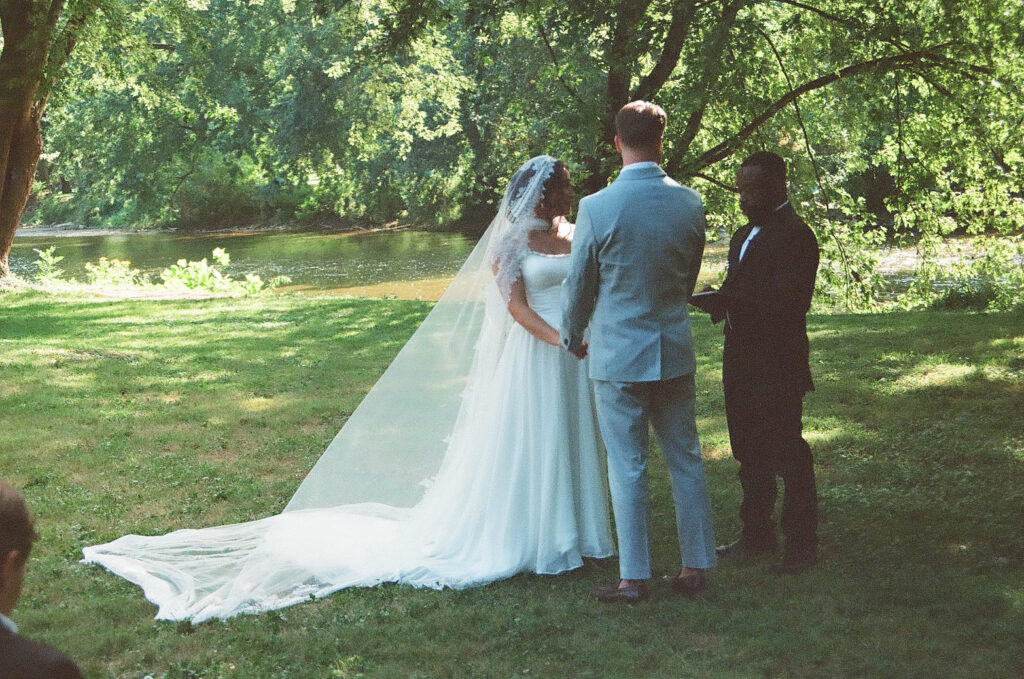 bride & groom ceremony at a jane austen inspired intimate backyard wedding