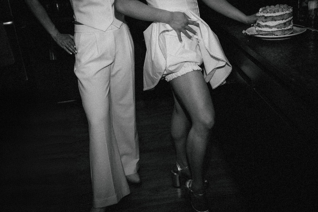 An Upstate New York Wedding at Woodhouse Lodge LGBTQ wedding cake cutting